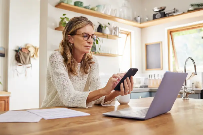 Woman using laptop for financing application