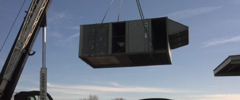 L & H Services installing a rooftop commercial system.